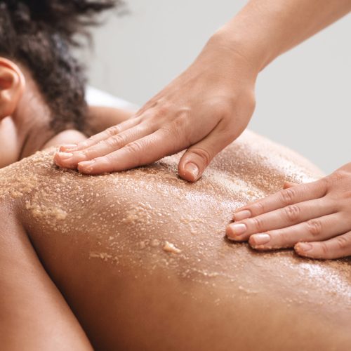 African,American,Relaxed,Lady,Having,Skin,Scrubbing,Procedure,At,Spa